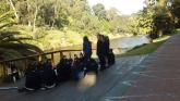 MGC students sampling on the Yarra River at the conoe launch with Julia