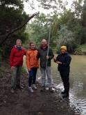 some of the group with the Creek in background- higher flow and more muddy than previous sampling
